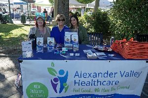 three women sitting at Alexander Valley table outside