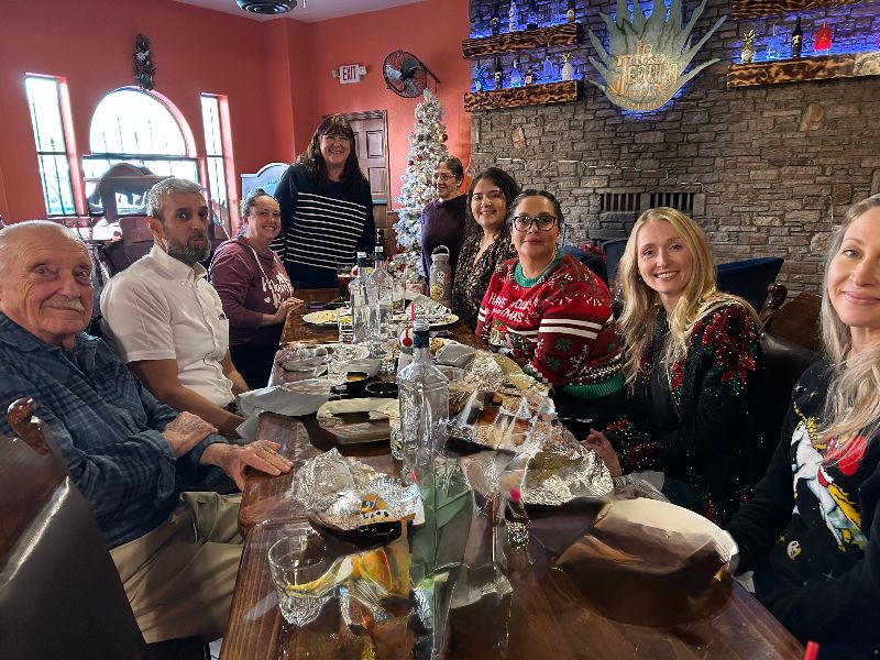 AVH staff sitting around table in a restaurant