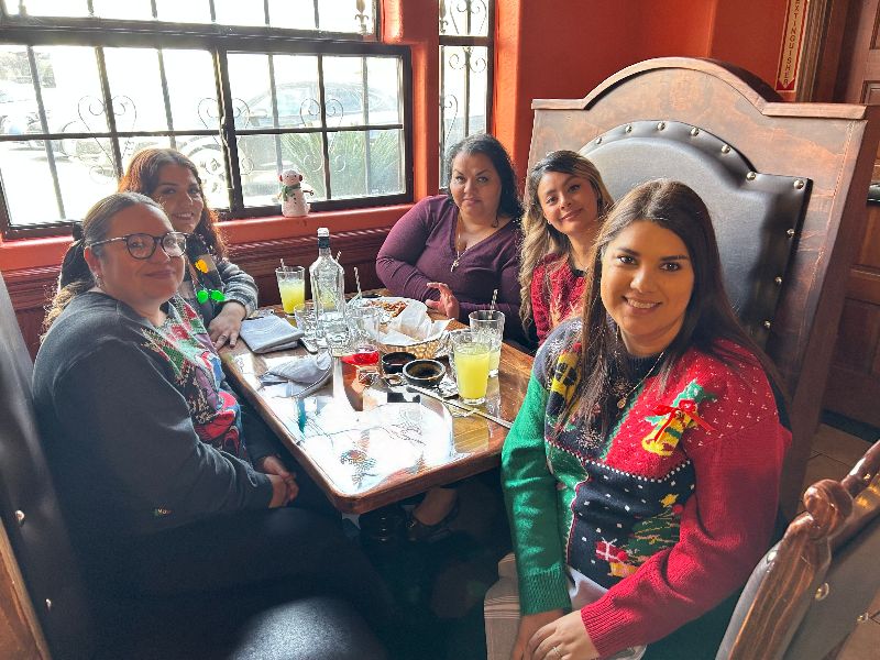 AVH staff sitting around table in a restaurant