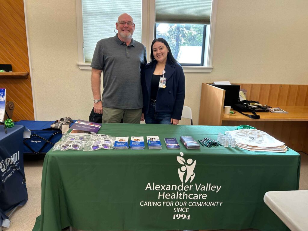 Chris Swartz and Catherine Zatarain at the AVH table at La Familia Sana Community Resilience and Resource Center