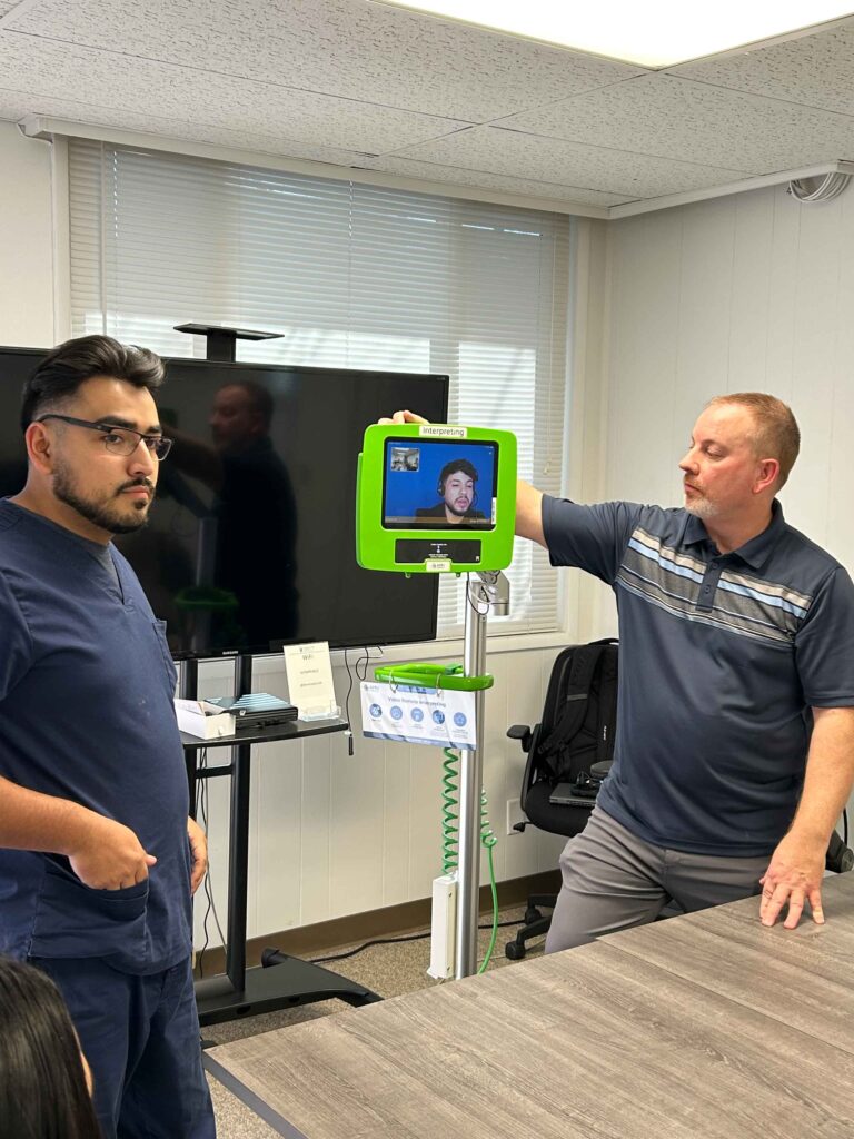 two men setting up interpreting service equipment